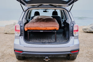 hideaway single sleeping platform in a subaru forester with aeronaut blanket